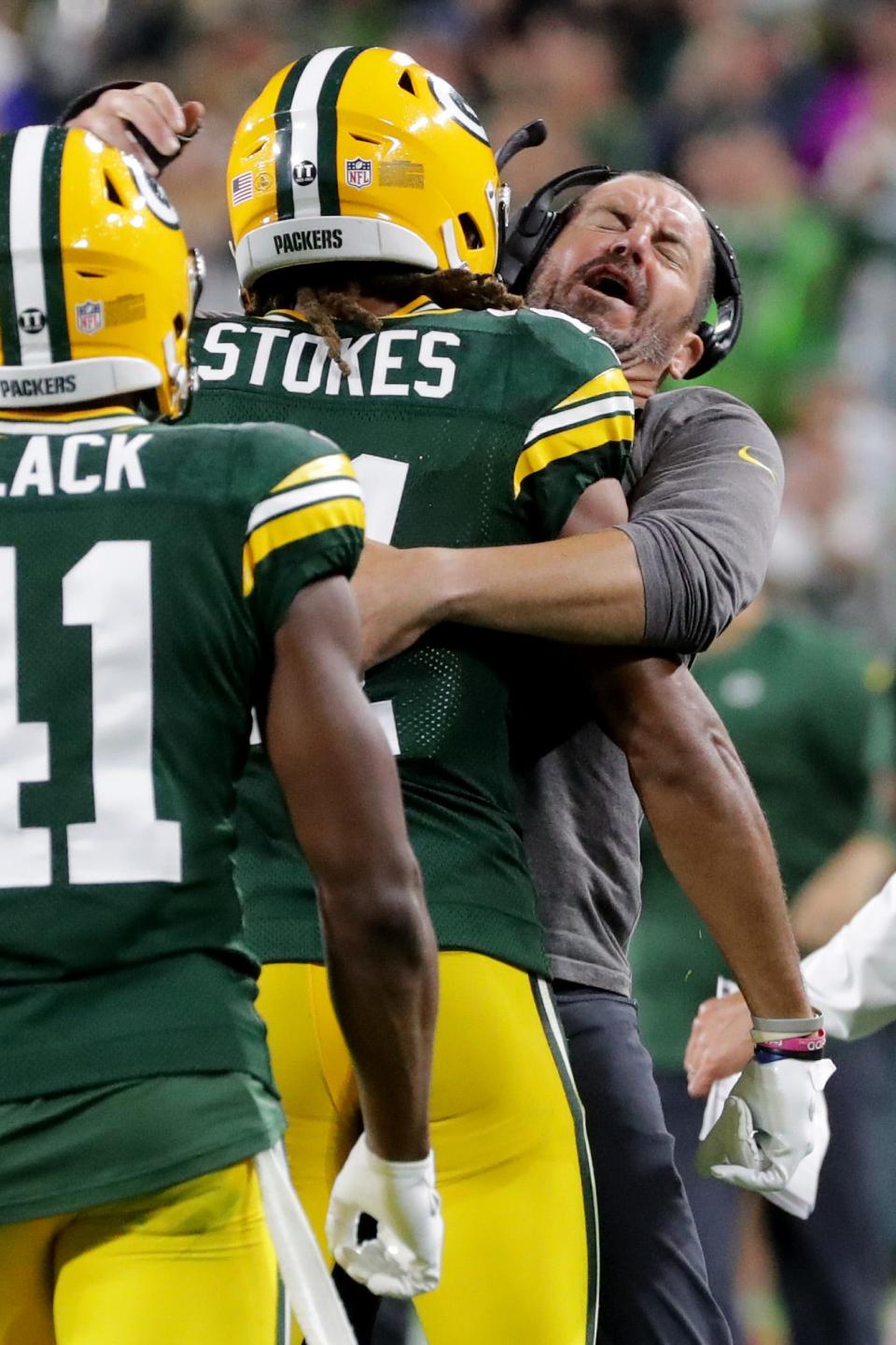 Green Bay Packers outside linebackers coach Mike Smith hugs cornerback Eric Stokes (21) after they stopped the Detroit Lions on fourth down during the third quarter of their game Monday, September 20, 2021 at Lambeau Field in Green Bay, Wis. The Green Bay Packers beat the Detroit Lions 35-17.
