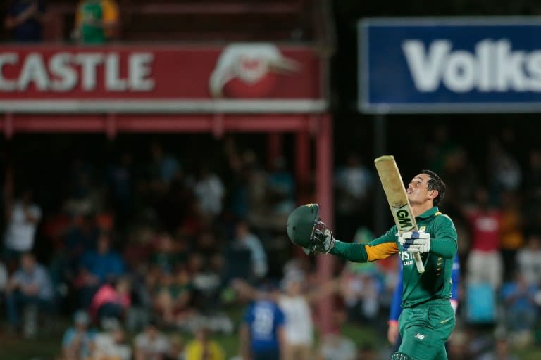 South African batsman Quinton De Kock celebrates after scoring a century during the first One Day International match between England and South Africa at Magaung Oval on February 3, 2016 in Bloemfontein