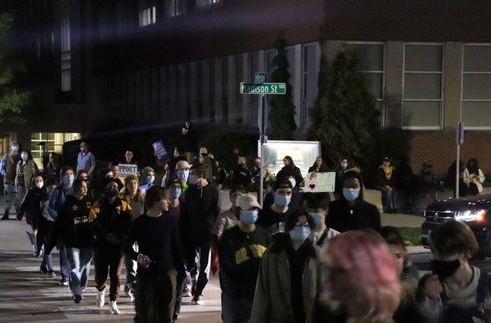 A large group of protesters circle the intersection of Jefferson and Madison streets on Oct. 16, 2023. Seven transgender protesters were charged with disorderly conduct and interference with official acts for their actions during protests against Cole's appearance and rhetoric.