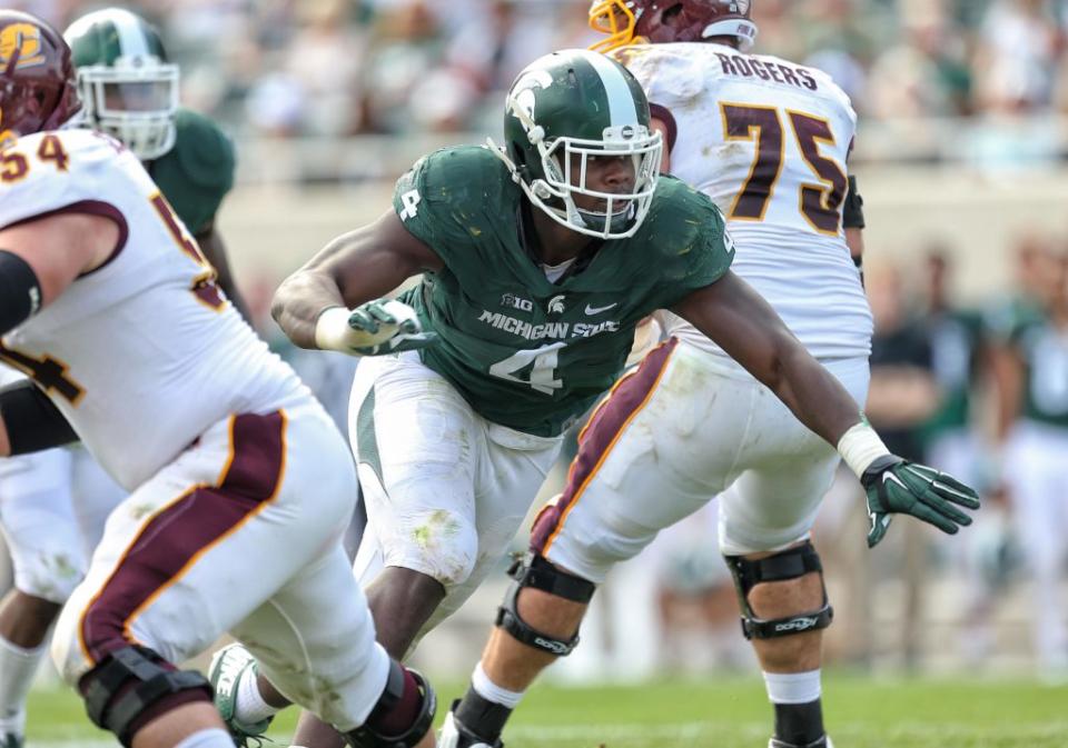 Sep 26, 2015; East Lansing, MI, USA; Michigan State Spartans defensive lineman Malik McDowell (4) breaks though the Central Michigan offensive line during the 2nd half of a game at Spartan Stadium. MSU won 30-10. Mandatory Credit: Mike Carter-USA TODAY Sports