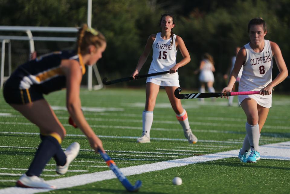 Portsmouth's Sydney Moreau (8) and Audrey Walsh (15) defend a Bow offensive player during Tuesday's Division II field hockey game. Bow handed Portsmouth its first loss, 4-0.