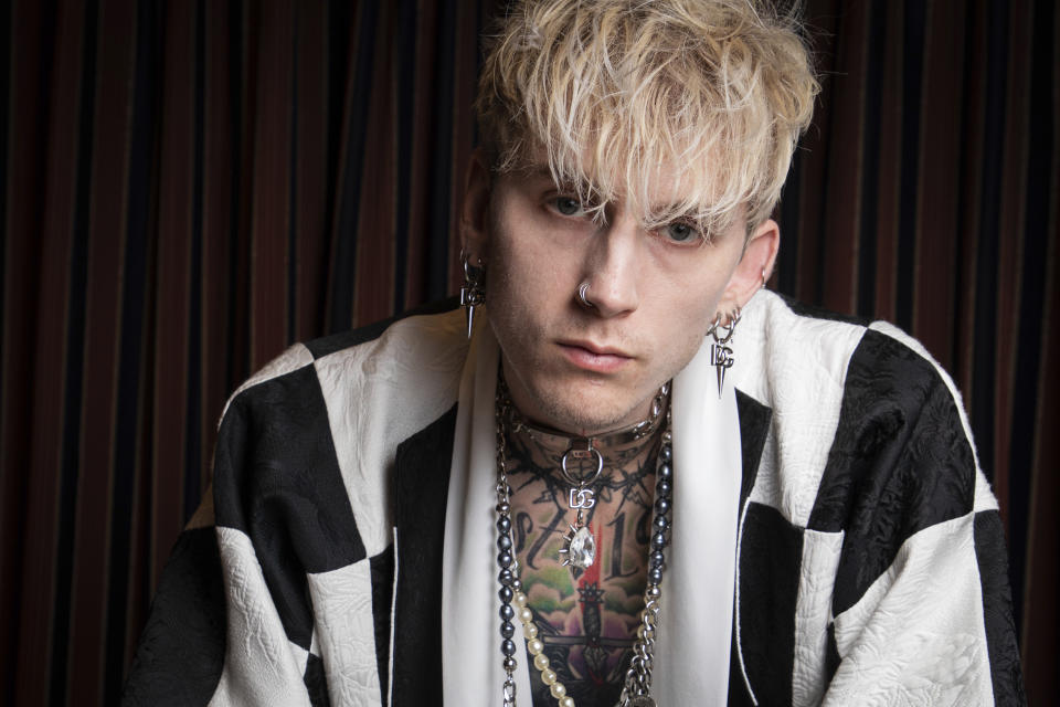 FILE - Actor-musician Colson Baker, also known as Machine Gun Kelly, poses for a portrait to promote the film "Taurus" during the International Film Festival Berlin 'Berlinale', in Berlin, Germany on Feb. 13, 2022. Baker plays Cole Taurus, a troubled rocker searching endlessly for the inspiration to record one final song. (Photo by Vianney Le Caer/Invision/AP, File)