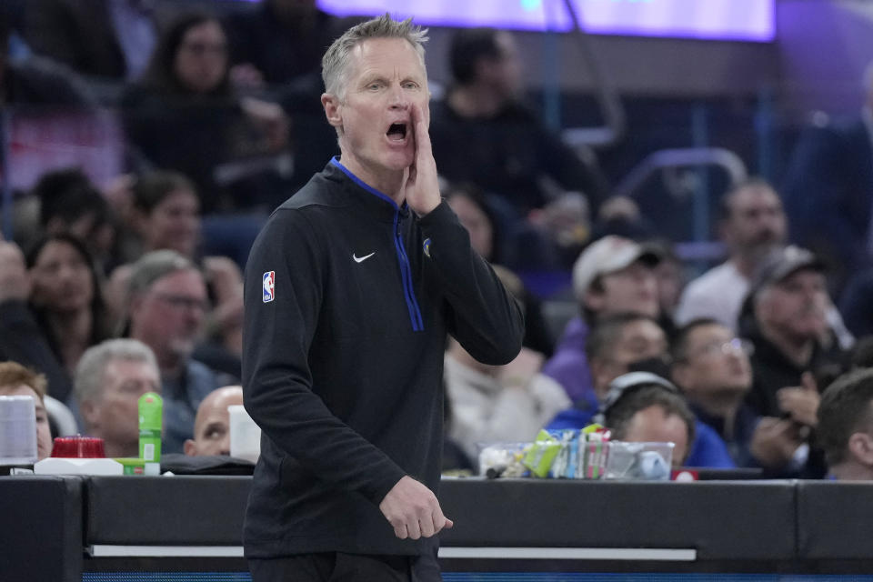 Golden State Warriors head coach Steve Kerr signals toward players during the first half of the team's NBA basketball game against the Los Angeles Clippers in San Francisco, Thursday, March 2, 2023. (AP Photo/Jeff Chiu)