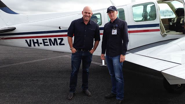 RBA Governor Glenn Stevens (right) flies his twin-engine Beechcraft Baron for Angel Flight. Pictured here with 7News reporter Mike Duffy.