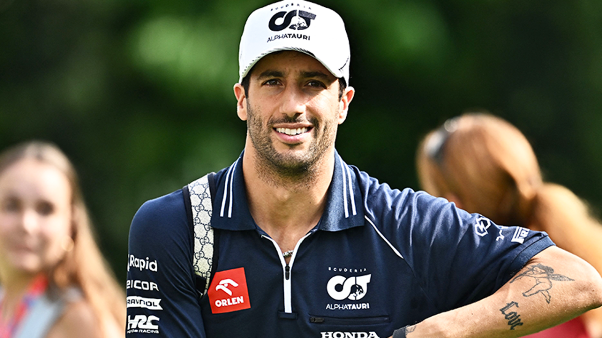 Mclaren driver Daniel Ricciardo of Australia shows a tattoo on his