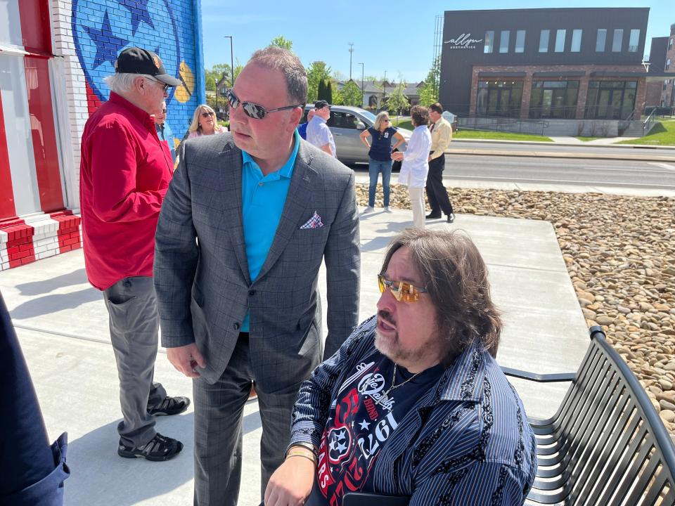 Judd Sellars speaks with Charlie Daniels Jr., sitting.