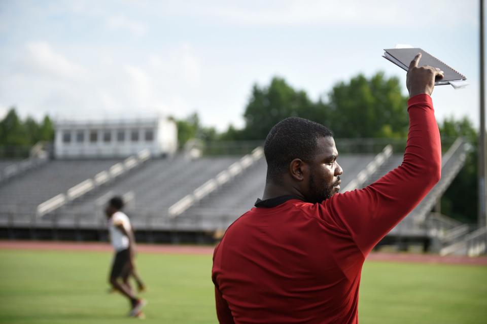 Cross Creek assistant coach Antoine Nabors leads practice at the school's football field on Thursday, July 21, 2022.