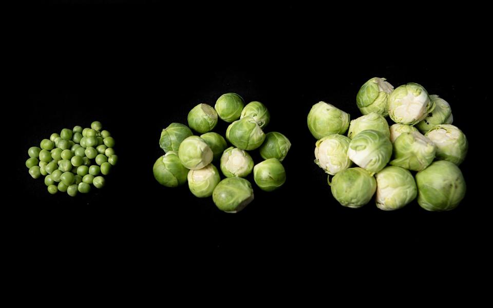 The 'baby sprouts' (centre) are being seen in supermarkets across the country, but can be more flavoursome and easier to roast than regular-sized sprouts. Left: peas - Rii Schroer