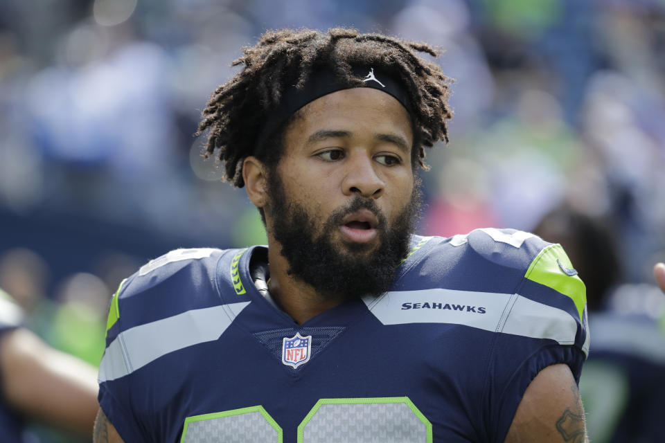 Earl Thomas stands on the field during warmups with the Seahawks before an NFL game in 2018.