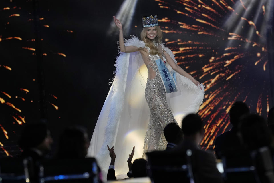 Krystyna Pyszková of Czech Republic waves after she was crowned Miss World in Mumbai, India, Saturday, Mar. 9, 2024. (AP Photo/Rajanish Kakade)