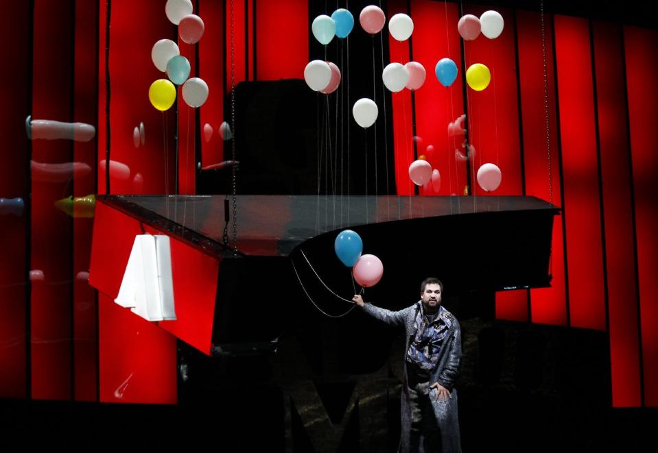 In this Feb. 24, 2012 photo, Rinaldo, played by David Daniels, laments the capture of Almirena, in a harpsichord shaped trap, during the final dress rehearsal at the Lyric Opera of Chicago's production of Rinaldo. (AP Photo/Charles Rex Arbogast)