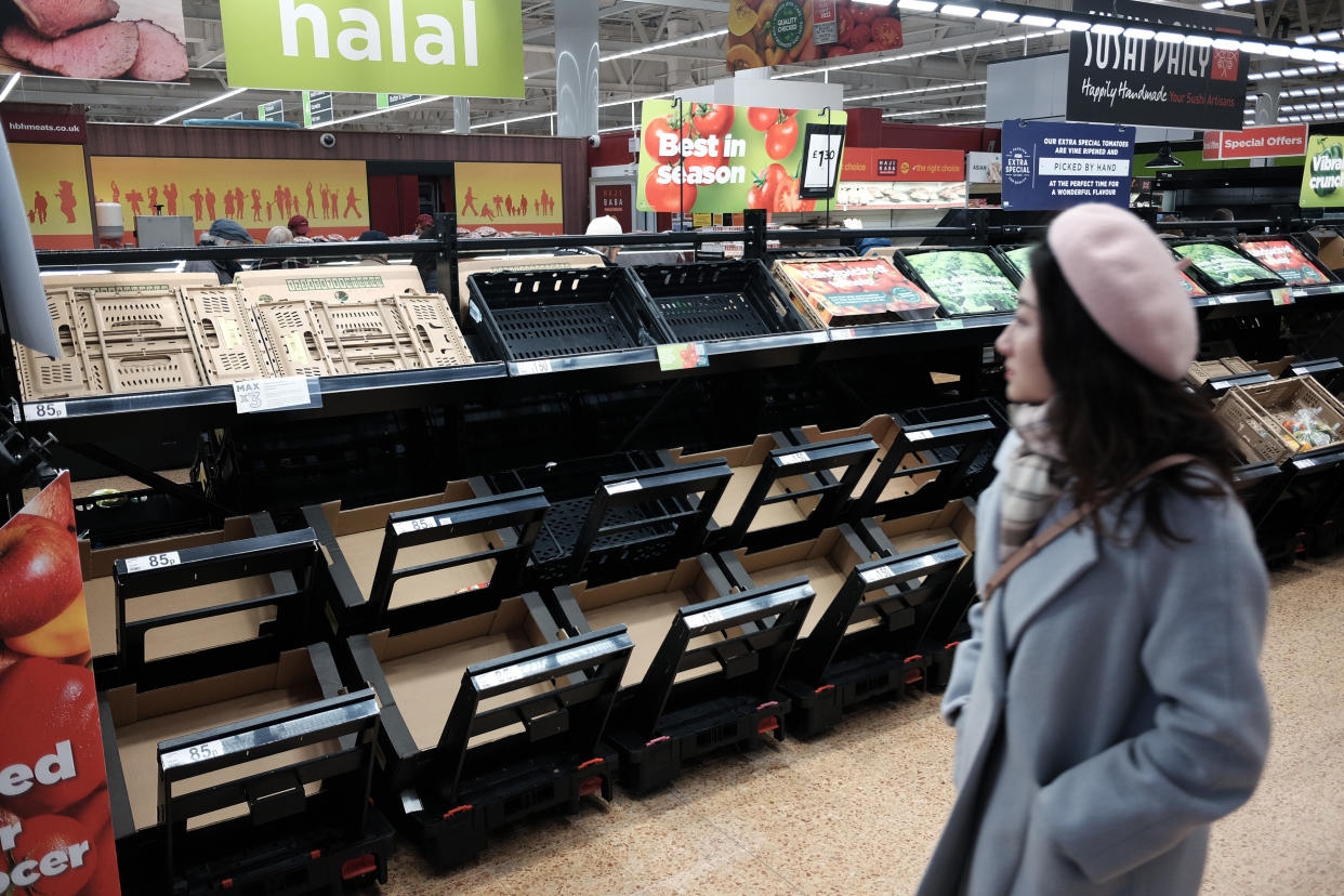 Empty fruit and vegetable shelves at an Asda in east London last month. (PA)