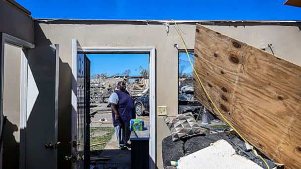 PHOTO: A man clears a damaged house in Rolling Fork, Miss., after a tornado touched down in the area, March 26, 2023. (Chandan Khanna/AFP via Getty Images)