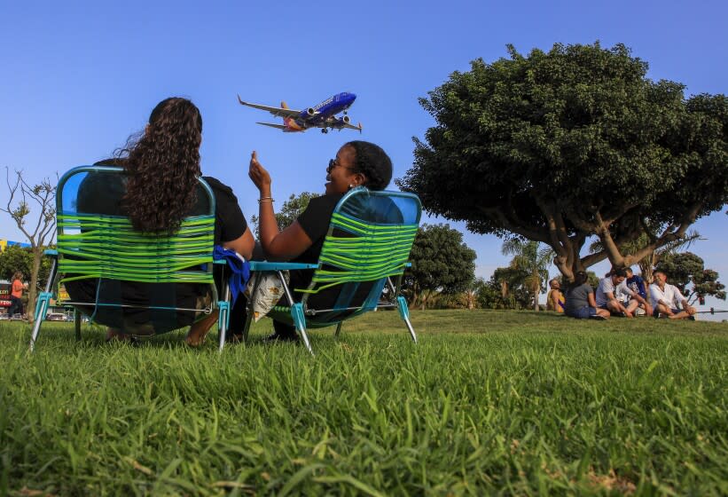WESTCHESTER, CA., SEPTEMBER 2, 2019: Labor Day is celebrated in many different ways, with some like Desiree Torres and Casandra Masters choosing to watch planes landing at LAX from a park off South Sepulveda Boulevard and West 92nd Street in Westchester September 2, 2019 (Mark Boster For the LA Times).