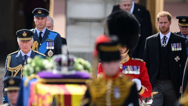 PHOTO: Britain's King Charles III, Britain's Prince William, Prince of Wales and Britain's Prince Harry, walk behind the coffin of Queen Elizabeth II, during a procession from Buckingham Palace to the Palace of Westminster, in London, Sept. 14, 2022.  (Daniel Leal/Pool via AFP/Getty Images)
