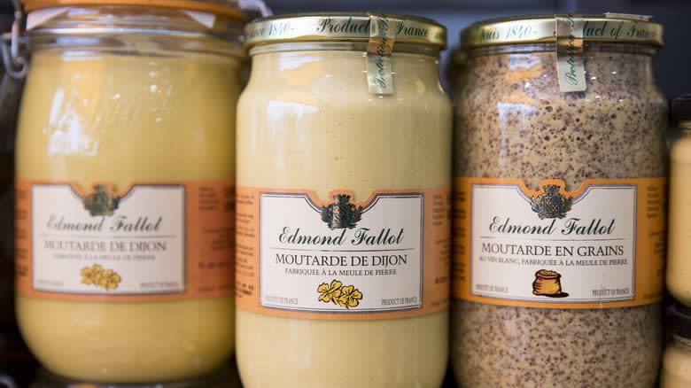 Different jars of mustard