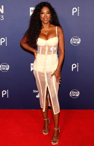 <p>Gabe Ginsberg/Getty Images</p> Kenya Moore's sheer look at BravoCon 2023.