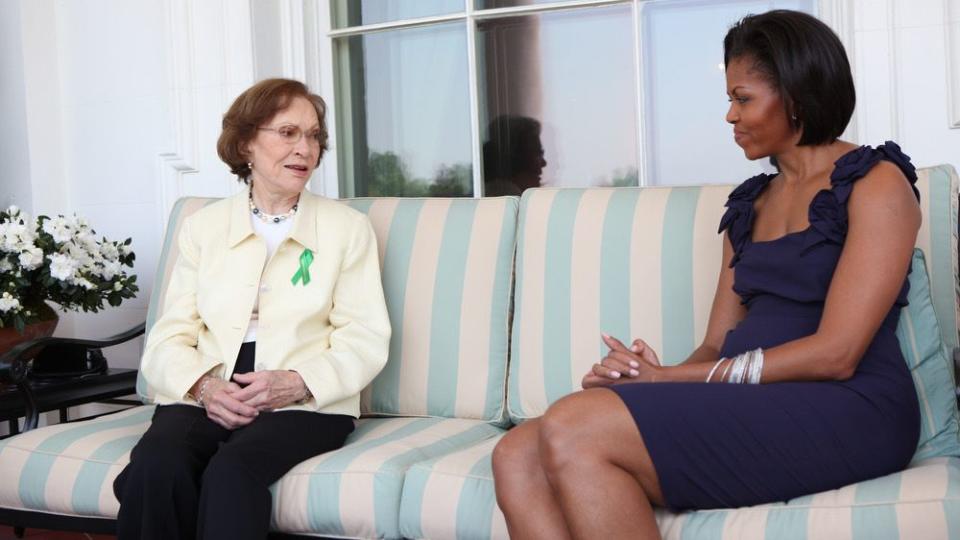 women sitting on a couch