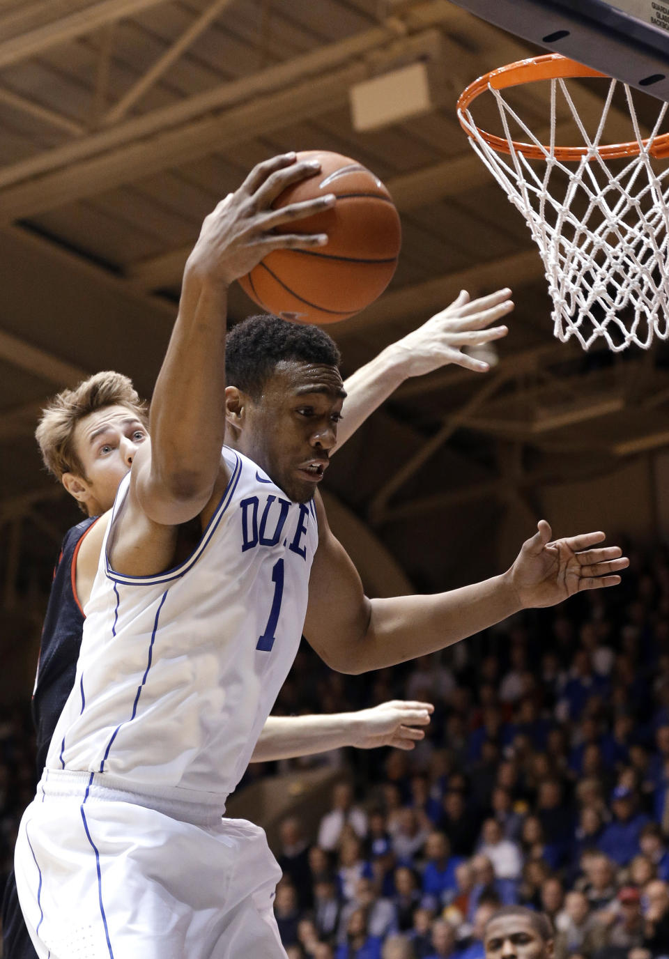 Duke's Jabari Parker (1) brings down a rebound against Maryland's Jake Layman during the second half of an NCAA college basketball game in Durham, N.C., Saturday, Feb. 15, 2014. Duke won 69-67. (AP Photo/Gerry Broome)