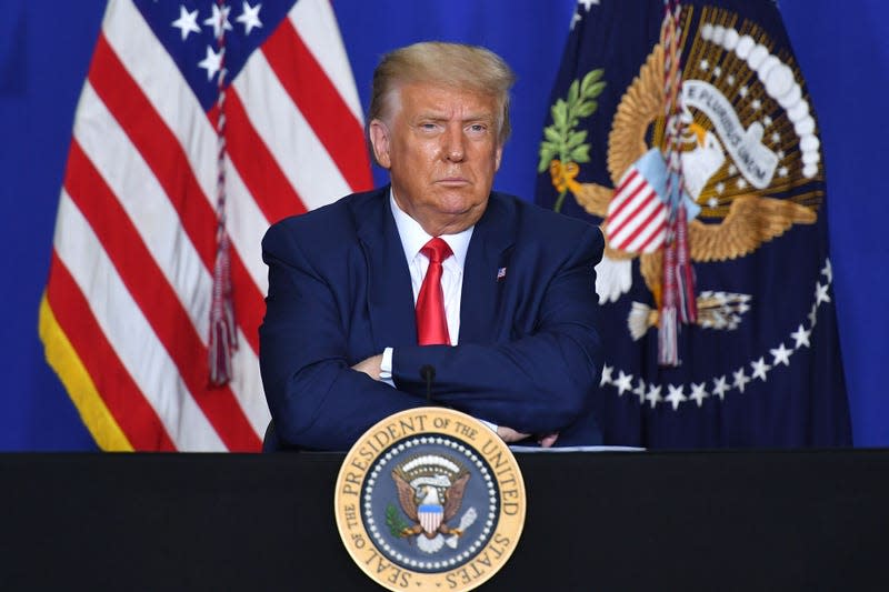 US President Donald Trump listens to officials during a roundtable discussion on community safety, at Mary D. Bradford High School in in Kenosha, Wisconsin on September 1, 2020. - Trump said Tuesday on a visit to protest-hit Kenosha, Wisconsin that recent anti-police demonstrations in the city were acts of “domestic terror” committed by violent mobs. “These are not acts of peaceful protest but really domestic terror,” Trump said, describing multiple nights of angry demonstrations last week after a white police officer in Kenosha shot a black man in the back at close range. - Photo: MANDEL NGAN / AFP (Getty Images)