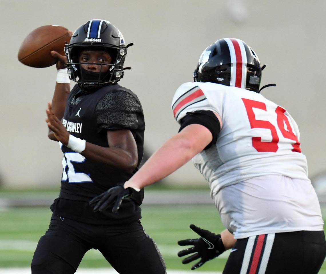 North Crowley quarterback Chris Jimerson, left looks to throw down the field as Lovjoy’s Braeden Gibson rushes him in the second quarter of Thursday’s September 8, 2022 football game at Crowley ISD Stadium in Fort Worth, Texas. North Crowley went on to win 28-20. Special/Bob Haynes