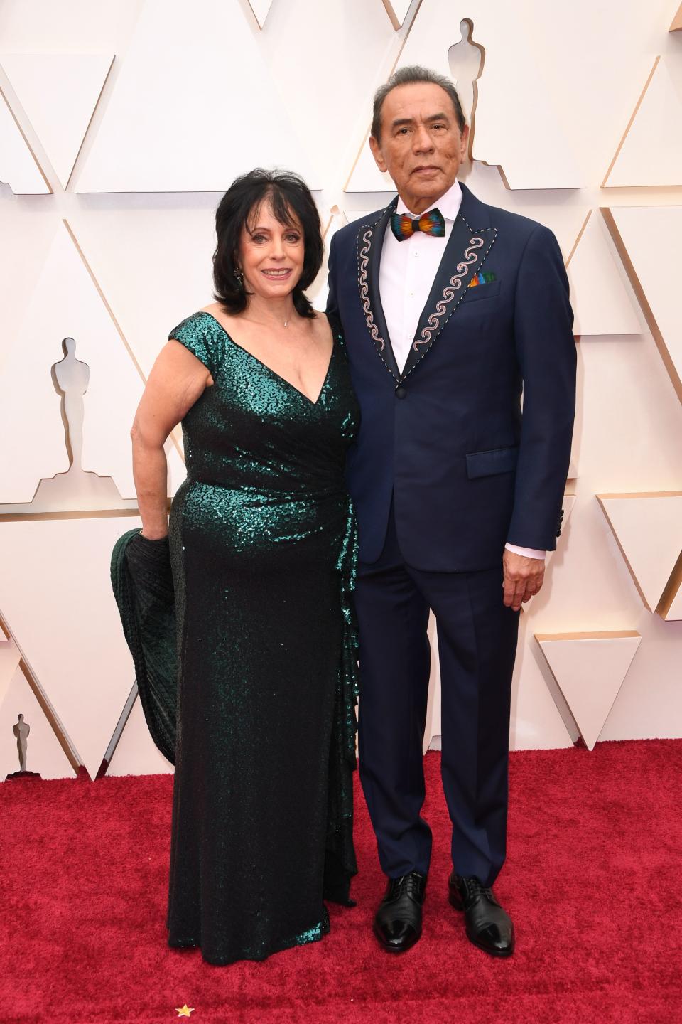 US actor Wes Studi (R) and wife singer Maura Dhu Studi arrive for the 92nd Oscars at the Dolby Theatre in Hollywood, California on February 9, 2020. (Photo by Robyn Beck / AFP) (Photo by ROBYN BECK/AFP via Getty Images)