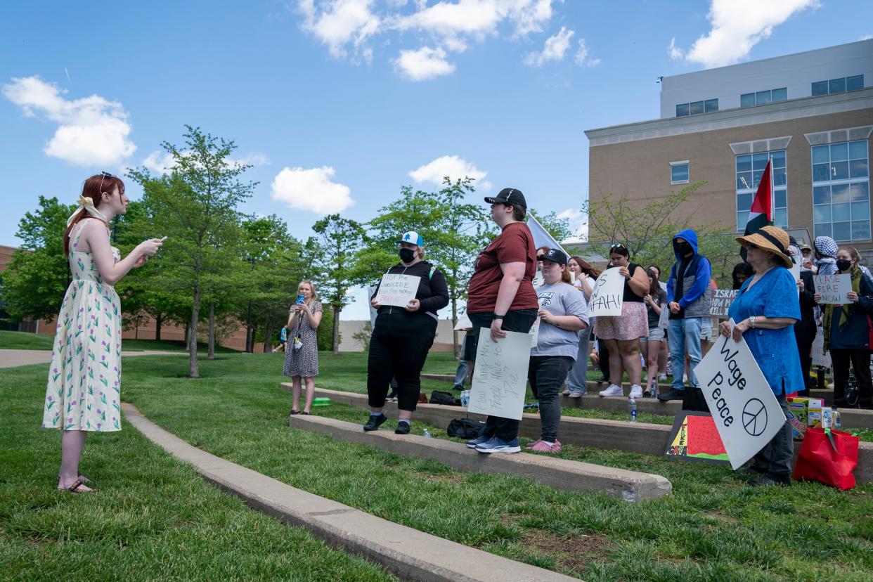 USI student Emily Dauphin speaks to the crowd of students and member of the public gathered outside the David L. Rice Library on the University of Southern Indiana campus to protest the war in Gaza in Evansville, Ind., Tuesday, April 30, 2024.