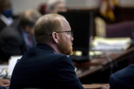 Travis McMichael listens to attorneys question a pool of prospective jurors during jury selection for the trial of he and his father Greg McMichael and William "Roddie" Bryan, at the Glynn County Courthouse, Monday, Oct. 25, 2021, in Brunswick, Ga. The trio are charged with the slaying of 25-year-old Ahmaud Arbery in February 2020. (AP Photo/Stephen B. Morton, Pool)