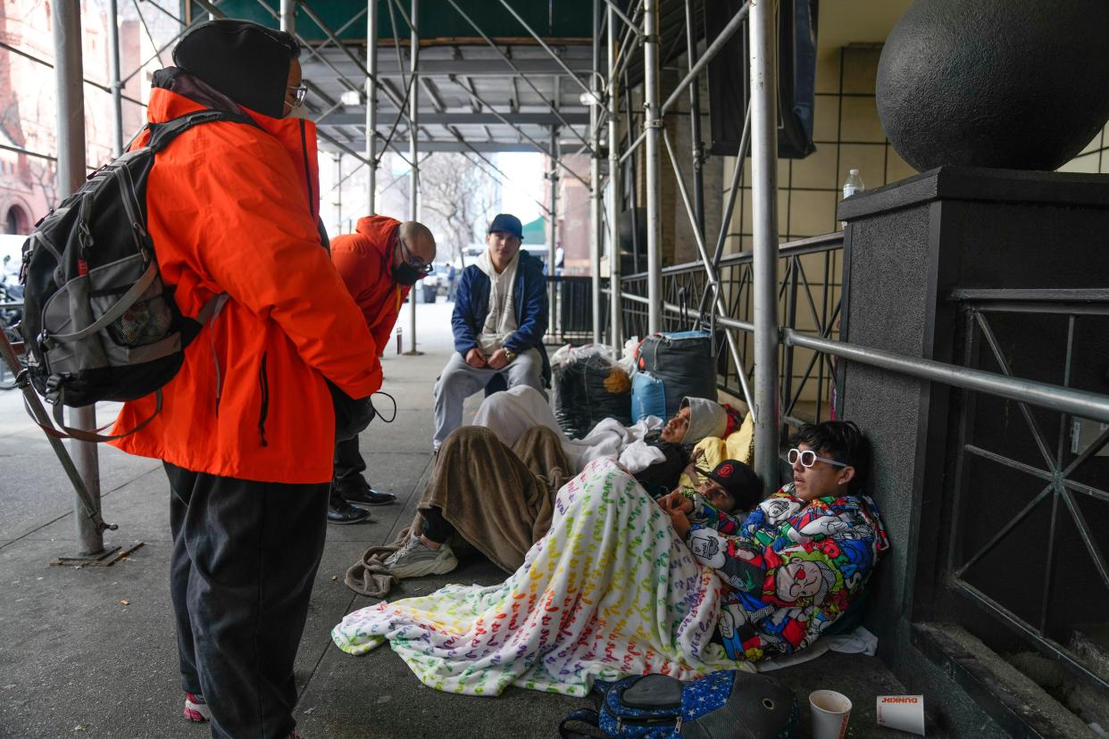 image of migrants camping out on a NYC street