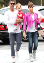 Jessica Alba covered up in a neon pink jacket [Splash]