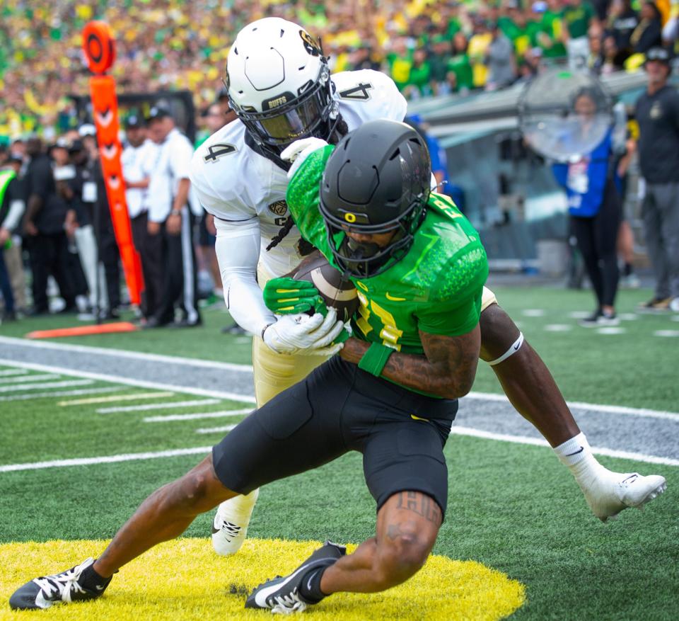 Oregon’s Troy Franklin pulls down a Bo Nix pass for a touchdown against Colorado’s raves Jay during the second quarter in Eugene Saturday, Sept. 23, 2023.