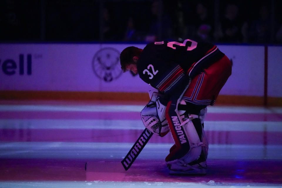 New York Rangers goaltender Jonathan Quick (32) observes the national anthem before an NHL hockey game against the Los Angeles Kings in New York, Sunday, Dec. 10, 2023. (AP Photo/Peter K. Afriyie)