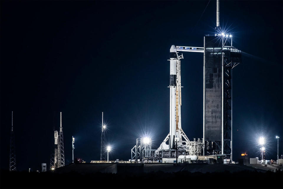 The Ax-2 Falcon 9 (foreground) stands atop historic pad 39A at the  Kennedy Space Center. Another Falcon 9, at left on pad 40 at the nearby  Cape Canaveral Space Force Station, blasted off early Friday to put 22  Starlink internet satellites into orbit. Another Falcon 9, this one  carrying Iridium and OneWeb satellites, was launched from Vandenberg  Space Force Base in California early Saturday. / Credit: SpaceX