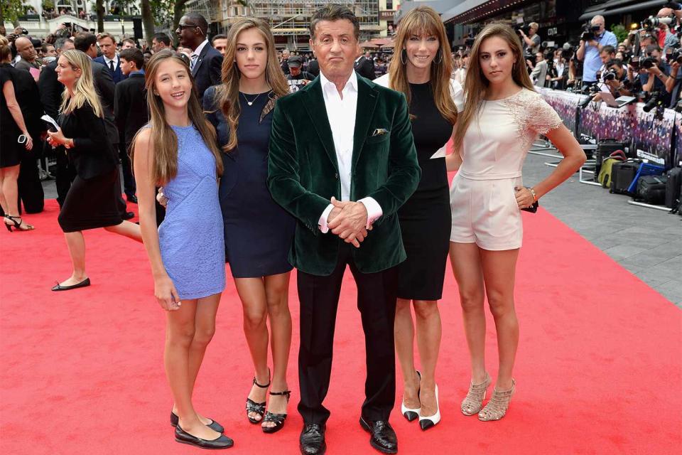 LONDON, ENGLAND - AUGUST 04: Sylvester Stallone (C) with his wife Jennifer Flavin (second right) and daughters as they attend "The Expendables 3" World Premiere at the Odeon Leicester Square on August 4, 2014 in London, England. The Expendables 3 is released on August 14, 2014. (Photo by Dave J Hogan/Getty Images for Lionsgate)