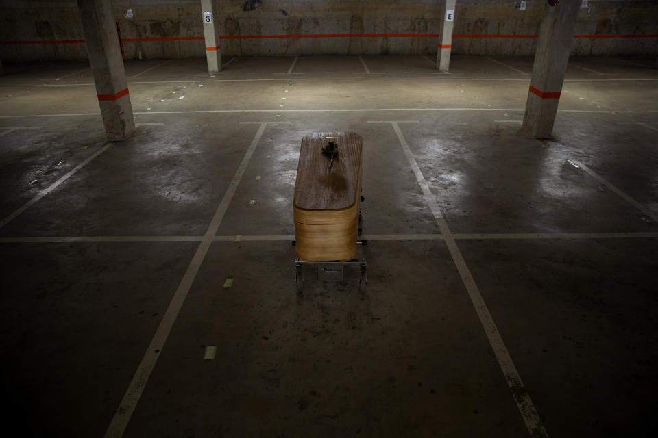 The coffin of the last COVID-19 victim stored at an underground parking garage that was turned into a morgue, at the Collserola funeral home in Barcelona, Spain. May 17, 2020. A funeral home in Barcelona has closed a temporary morgue it had set up inside its parking garage to keep the victims of the Spanish city's coronavirus outbreak. The last coffin was removed and buried on Sunday. In 53 days of use, the temporary morgue has held more than 3,200 bodies. (AP Photo/Emilio Morenatti)