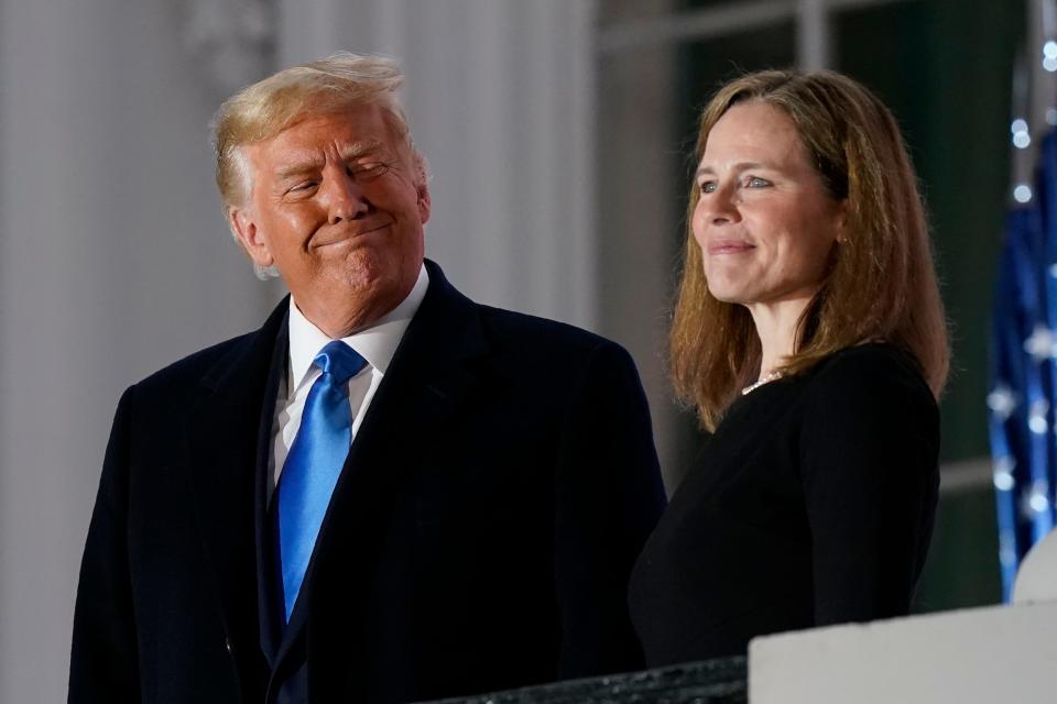 President Donald Trump and Justice Amy Coney Barrett at the White House in Washington, D.C., on Oct. 26, 2020.