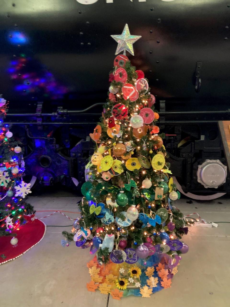 Soul Purpose, a Green Bay arts collaboration, used old CDs to create a technicolor tree at the National Railroad Museum's Festival of Trees in Ashwaubenon.