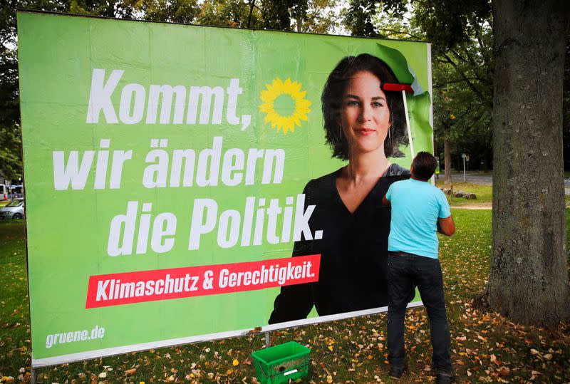 Placards being placed on boards in Bonn for Germany’s general election on September 26