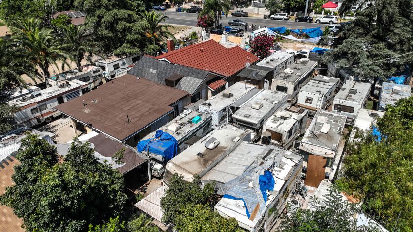 Sylmar, CA, Monday, July 24, 2023 - Dozens of motor homes parked at a residence on Hubbard St. where authorities have red tagged some because of various code violations and safety issues. (Robert Gauthier/Los Angeles Times)