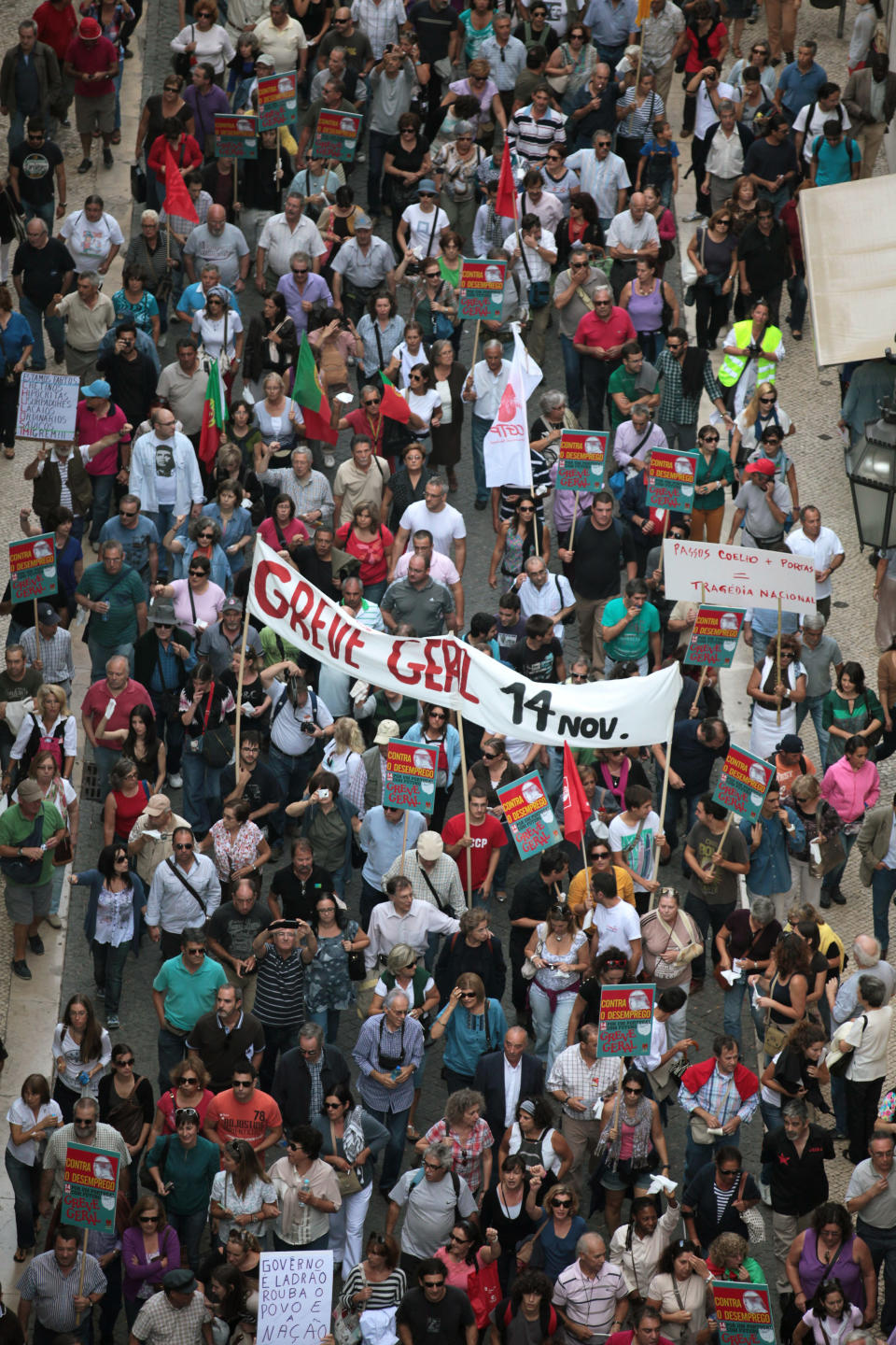 A banner calling for a general strike on November 14 is carried by demonstrators during a protest march against austerity measures as they head to the Portuguese parliament in Lisbon Saturday, Oct. 13 2012. Unemployment figures in Portugal have soared since the introduction of austerity measures to fight the country's debt crisis. (AP Photo/Armando Franca)