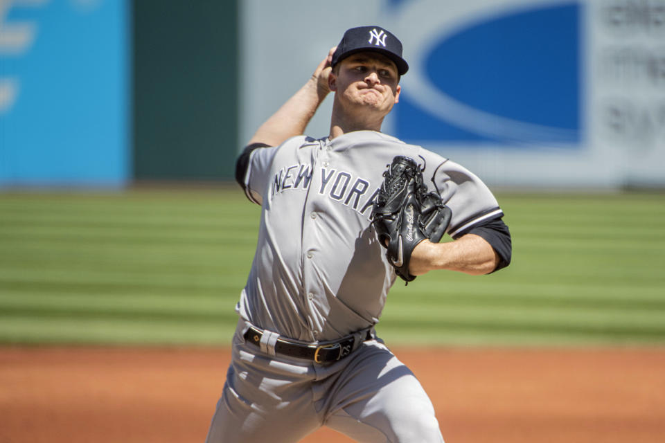 New York Yankees starting pitcher Clarke Schmidt delivers against the Cleveland Guardians during the first inning of a baseball game in Cleveland, Wednesday April 12, 2023. (AP Photo/Phil Long)