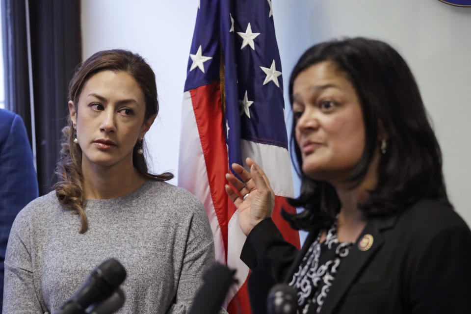 Negah Hekmati, left, looks on as Rep. Pramila Jayapal, D-Wash., addresses a news conference about Hekmati's ordeal during an hours-long delay returning to the U.S. from Canada with her family days earlier, Monday, Jan. 6, 2020, in Seattle. Civil rights groups and lawmakers were demanding information from federal officials following reports that dozens of Iranian-Americans were held up and questioned at the border as they returned to the United States from Canada over the weekend. In a statement Sunday, the Washington state chapter of the Council on American-Islamic Relations said more than 60 Iranians and Iranian-Americans were detained and questioned at the Peace Arch Border Crossing in Blaine, Washington. (AP Photo/Elaine Thompson)
