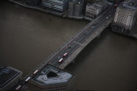 <p>London Bridge extends across the Thames from the Shard, the tallest building in the European Union, as the sun sets on March 28, 2017 in London, England. (Jack Taylor/Getty Images) </p>