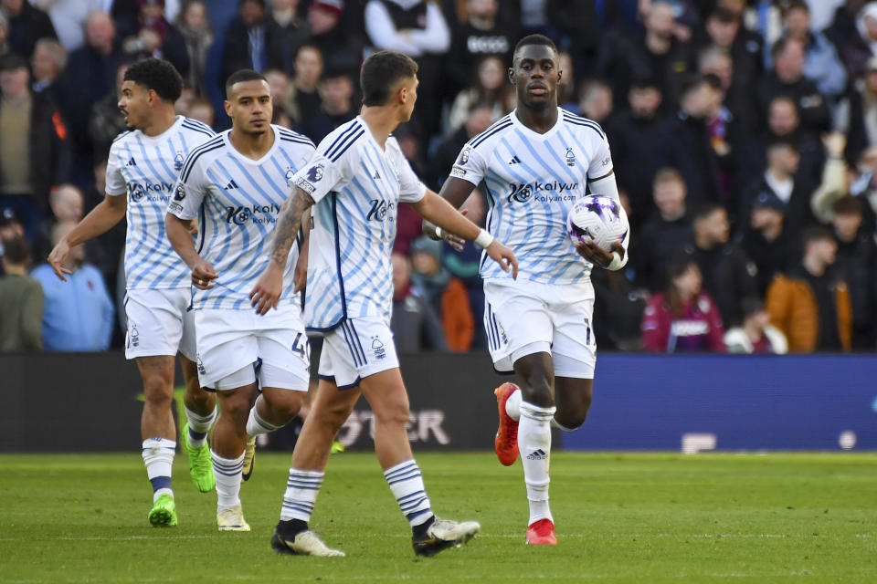 Nottingham Forest's Moussa Niakhate holds the ball after scoring his side's opening goal during the English Premier League soccer match between Aston Villa and Nottingham Forest at the Villa Park stadium in Birmingham, England, Saturday, Feb. 24, 2024. (AP Photo/Rui Vieira)