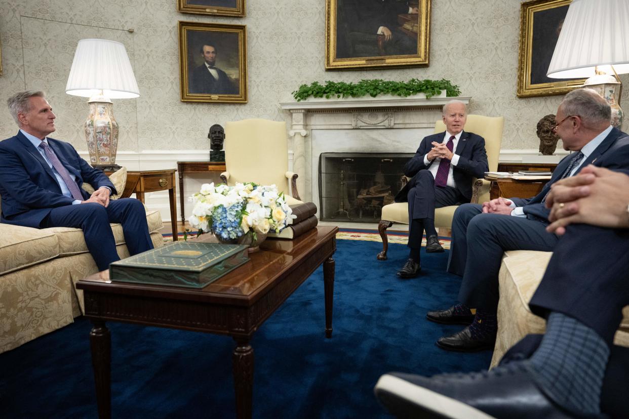 (L to R) Speaker of the House Kevin McCarthy (R-CA), US President Joe Biden, and Senate Majority Leader Charles E. Schumer (D-NY) wait for a meeting about the United States's debt ceiling in the Oval Office of the White House May 9, 2023, in Washington, DC. Biden and Republican leaders met in hopes of breaking an impasse over the US debt limit. The lifting of the national debt ceiling  allows the government to pay for spending already incurred. (Photo by Brendan Smialowski / AFP) (Photo by BRENDAN SMIALOWSKI/AFP via Getty Images)