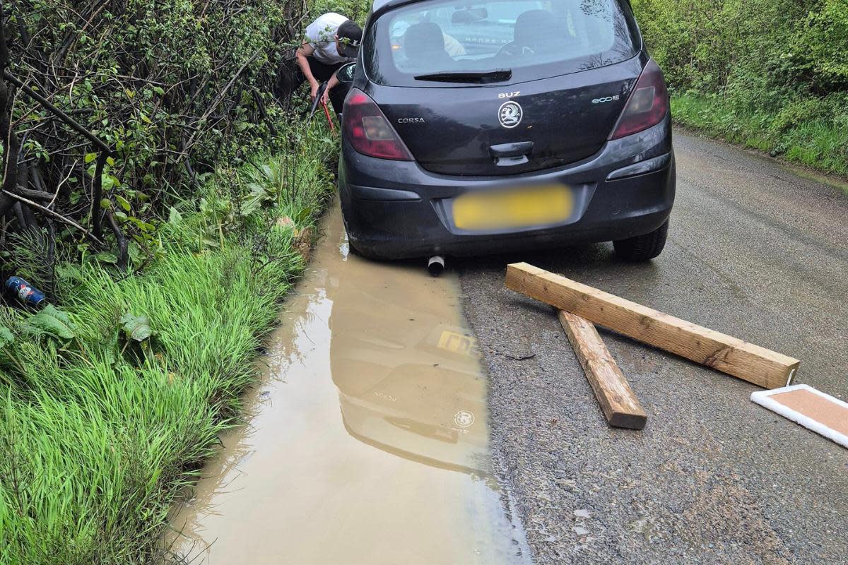 Suzanne Onslow was left shaken up after her Corsa, pictured, got stuck in a '8 inch' pothole in Burnetts Lane, Hampshire <i>(Image: Selena Bishop)</i>