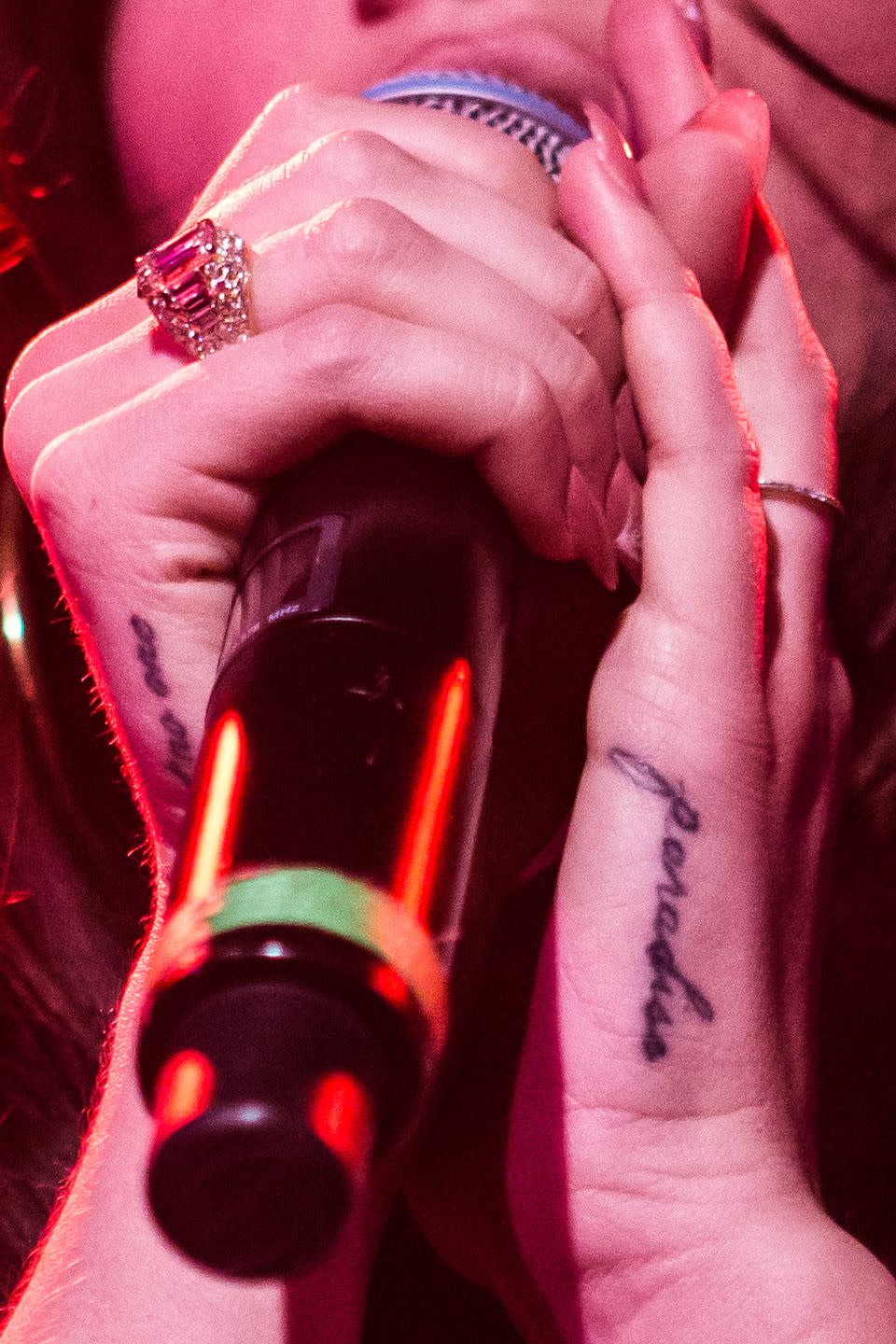 <p>On the singer's left hand she has the word “paradise,” the name of her third album, inked in cursive.</p>