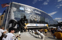 FILE - In this May 29, 2017, file photo, fans wait outside PPG Paints Arena for Game 1 of the NHL hockey Stanley Cup Finals between the Pittsburgh Penguins and the Nashville Predators, in Pittsburgh. PPG Paints Arena is one of the possible locations the NHL has zeroed in on to host playoff games if it can return amid the coronavirus pandemic. The league will ultimately decide on two or three locations for games, with government regulations, testing and COVID-19 frequency among the factors for the decision that should be coming within the next three to four weeks. (AP Photo/Gene J. Puskar, File)