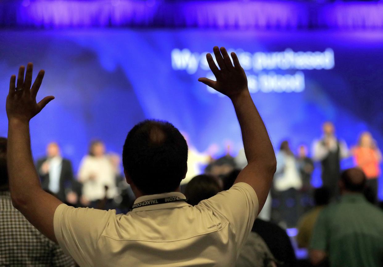 People worship during the Southern Baptist Convention annual meeting in 2017. A document released in May indicates that there are 12 Ohio pastors on a previously-secret list of more than 700 Southern Baptist pastors and church personnel who have allegedly sexually abused people.