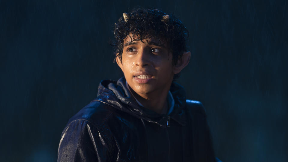 Satyr stands in the rain looking at someone off-screen in Percy Jackson and the Olympians